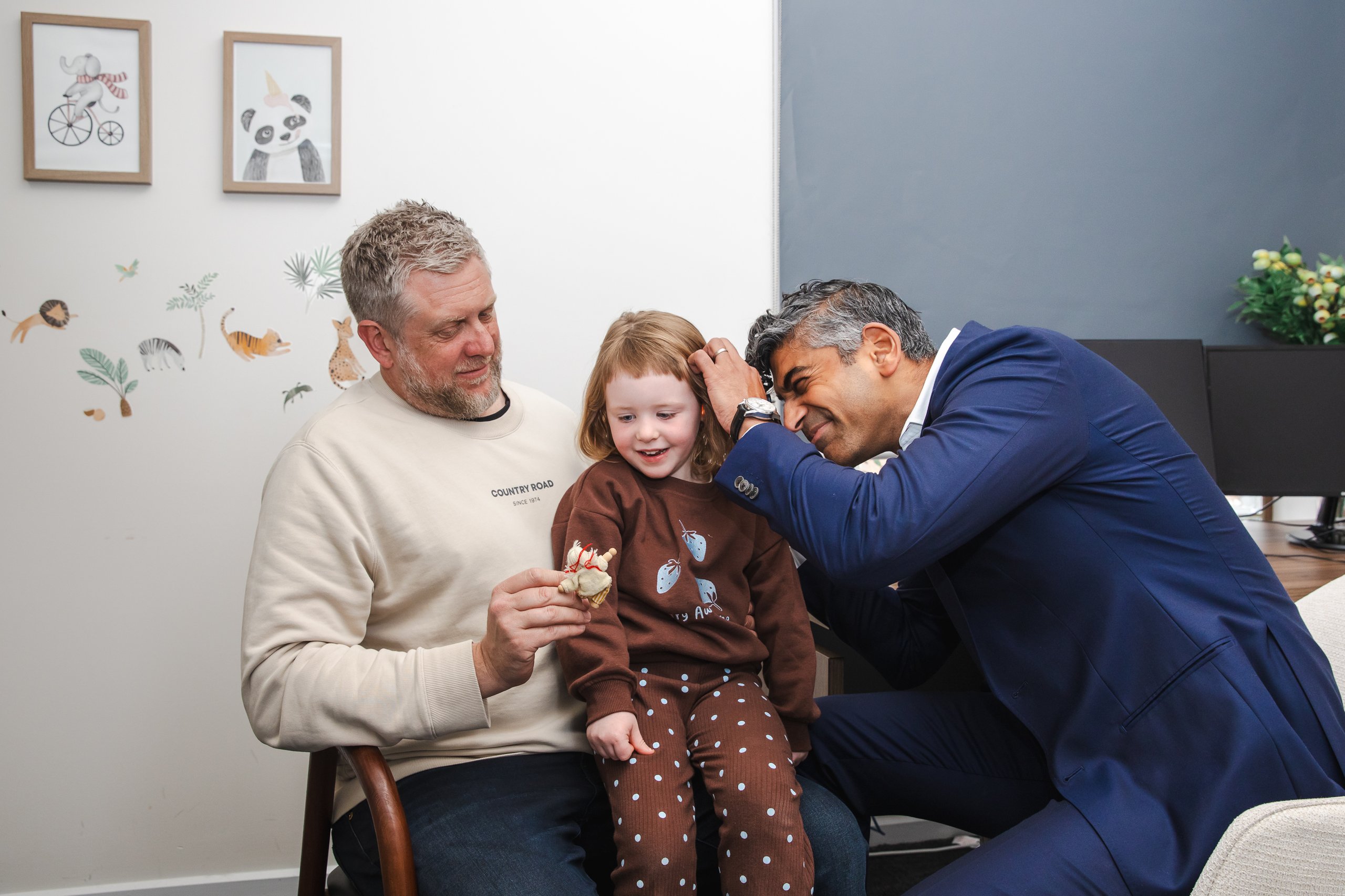 A Halsa doctor caring for a child at home